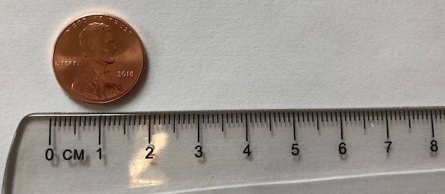 A penny being measured